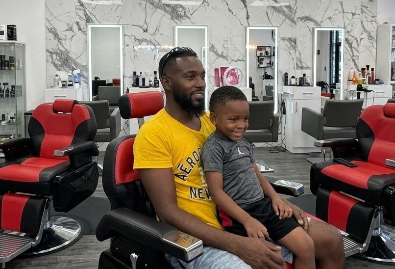Father and son men's grooming experience at Deluxe Glow Esthetic Bar